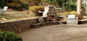 Stone-retaining-wall-and-stone-fireplace